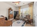 Bright office space with neutral walls, ceiling fan, window and blinds, and classic furniture, including a desk and chairs at 163 Carmen Way, Lancaster, SC 29720