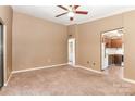 Neutral living room with carpet, ceiling fan, and openings to other rooms at 1638 Hunters Trl, Rock Hill, SC 29732
