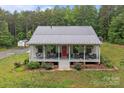 Beautiful home offers a spacious front porch, perfect for relaxing and enjoying the surrounding landscape at 213 Genesis Pl, Cleveland, NC 27013