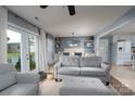 Open-concept living area with a view of the dining area and a door leading to the backyard at 318 Confederate Sw Dr, Concord, NC 28027