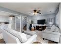 Living room with light blue walls, hardwood floors, and staircase to the second floor at 318 Confederate Sw Dr, Concord, NC 28027