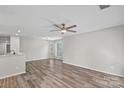 Bright living room featuring modern ceiling fan, and wood flooring offering a stylish and comfortable living space at 409 W 8Th St, Charlotte, NC 28202