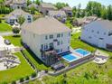 Expansive backyard boasts a deck, trampoline, and multi-game court surrounded by lush landscaping at 424 Cassia Ct, Fort Mill, SC 29708