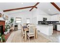 Bright dining area with vaulted ceilings, adjacent to an updated kitchen, creating a seamless living space at 5929 Brookhaven Rd, Charlotte, NC 28210
