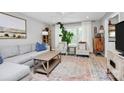 Sun-filled living room with stylish decor, a cozy seating area, and large windows offering great views at 5929 Brookhaven Rd, Charlotte, NC 28210