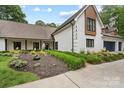 Lovely home with well-kept landscaping, showcasing brick and wood accents and a welcoming facade at 7017 S Providence Rd, Waxhaw, NC 28173