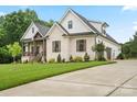 Beautiful home with a three car garage, well manicured lawn and beautiful trees at 867 Bellegray Rd, Clover, SC 29710