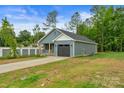 Single-Gathering home featuring gray siding, attached garage, and driveway at 101 Churchill Dr, Kings Mountain, NC 28086