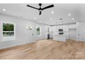 Bright, open-concept living area with sleek flooring, modern fixtures, and a kitchen island at 103 Churchill Dr, Kings Mountain, NC 28086