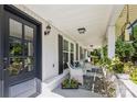 Inviting front porch with rocking chairs, stylish accents, and a beautiful entry door at 106 Phifer St, Fort Mill, SC 29715