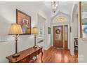 Elegant foyer with hardwood floors, arched entryways, and decorative lighting at 1070 Blueberry Rd, Salisbury, NC 28147
