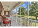 Inviting screened porch with rocking chairs, offering a relaxing outdoor space at 1070 Blueberry Rd, Salisbury, NC 28147