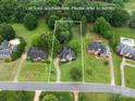 Aerial view of the property showing the house, lot lines, and surrounding neighborhood at 1912 Windmere Dr, Monroe, NC 28110
