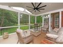 Relaxing screened-in porch featuring comfortable seating and a ceiling fan at 1912 Windmere Dr, Monroe, NC 28110