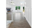 Bright entryway with wood-look floors, leading to an open living space and outdoor deck at 2027 Marquesas Ave, Tega Cay, SC 29708