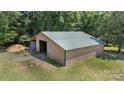 Spacious outbuilding with ample storage and a well-maintained exterior, perfect for a variety of uses at 2291 Howell Rd, Midland, NC 28107