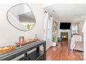 Cozy living room showcasing hardwood floors, a fireplace, and a modern decor at 2636 Forest Grove Ct, Charlotte, NC 28269