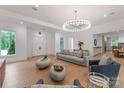 Spacious living room with modern lighting, neutral tones, and an open layout at 3020 Brooks Mill Ln, Wingate, NC 28174