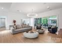 Bright and airy living room with a view to an outdoor patio and elegant decor at 3020 Brooks Mill Ln, Wingate, NC 28174