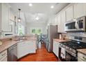 Bright kitchen features stainless steel appliances, granite countertops, and hardwood floors at 3912 Grace Ct, Indian Trail, NC 28079