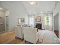 Bright living room features a fireplace, ceiling fan, and a neutral color palette at 3912 Grace Ct, Indian Trail, NC 28079