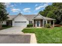 Charming single Gathering home with a well manicured lawn and attached garage at 6204 Half Dome Dr, Charlotte, NC 28269