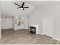 Spacious living room featuring vaulted ceilings, a fireplace and built-in shelving at 6204 Half Dome Dr, Charlotte, NC 28269