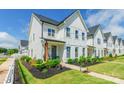 Charming townhome featuring a landscaped front yard, tidy plants and a welcoming entrance at 651 Melville Dr, Rock Hill, SC 29732