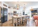 Bright kitchen featuring white cabinetry, stylish pendant lighting, and modern appliances at 651 Melville Dr, Rock Hill, SC 29732
