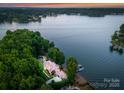 Picturesque home on Lake Norman with mature trees, private dock, stone seawall and lush landscaping at 9184 Greenwood Rd, Terrell, NC 28682