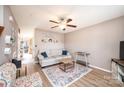 A cozy living room features neutral walls, ceiling fan, modern furniture, and stylish decor at 102 Brandywine Ne Dr # O-3, Conover, NC 28613