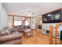 Cozy living room with hardwood floors, wood trim, and an open layout to additional rooms at 109 Larch Rd, Salisbury, NC 28147