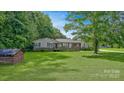 Ranch style home with a well-manicured front yard and concrete driveway at 1435 W Ridge Rd, Salisbury, NC 28147
