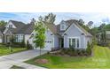 Beautiful exterior view of a well-maintained single-Gathering home with lush green lawn at 14531 Crosswater Ln, Charlotte, NC 28278