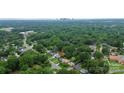 Beautiful aerial view of the property, surrounded by lush greenery and near the city at 2421 Shamrock Dr, Charlotte, NC 28205