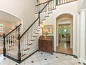 View of the foyer showing a staircase, marble floors and a glimpse of a living room at 2516 Selwyn Ave, Charlotte, NC 28209