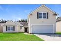Charming home featuring a two-car garage, lawn, and neutral siding at 2599 April Showers Ln, Rock Hill, SC 29730