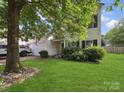 Charming two-story home featuring manicured lawn, vinyl siding, and traditional window shutters at 3014 Robin Terry Ct, Charlotte, NC 28208