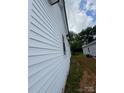 Close up shot of white horizontal siding, accentuating the clean lines and fresh aesthetic of the house at 324 S Spruce St, Rock Hill, SC 29730