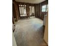 Spacious living room awaiting transformation, showcasing exposed framing and a large window for ample natural light at 324 S Spruce St, Rock Hill, SC 29730