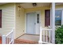 Close-up of a charming front porch with a classic white door, perfect for welcoming guests at 3537 Heather Ln, Gastonia, NC 28056