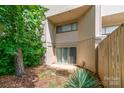 Townhome exterior featuring sliding glass doors to the backyard and neutral-toned siding at 3617 Willow Point Dr, Charlotte, NC 28277