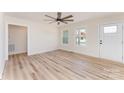 Bright, airy living room with luxury vinyl floors, neutral walls, modern ceiling fan, and lots of natural light at 406 N Bostian St, China Grove, NC 28023