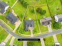 Aerial view of a residential property with a well-defined lot and surrounding greenery at 4809 Mossy Cup Ln, Monroe, NC 28110