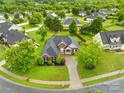 Scenic aerial view of a home nestled in a lush, green neighborhood at 4809 Mossy Cup Ln, Monroe, NC 28110
