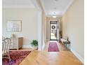 Welcoming entryway with hardwood floors, decorative rug, and natural light at 499 Granite Lake Ct, Denver, NC 28037