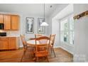 Bright dining area featuring wood floors, a round table, and natural light from window at 513 Pate Dr, Fort Mill, SC 29715