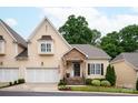 Charming home with stone porch, manicured lawn, two car garage, and well-maintained landscaping at 5917 Bridger Ct, Charlotte, NC 28211