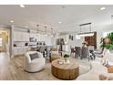 Open-concept living space with modern decor, a dining area, and a fully equipped kitchen at 602 Compass Dr, Denver, NC 28037