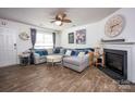 Inviting living room features a fireplace and a large sectional sofa at 7527 Finnigan Rd, Charlotte, NC 28215